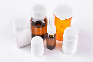 Set of medicine in glass and plastic bottles. Medicaments in different bottles for cold treatment. Medicine, health care and pharmaceutical drugs concept.