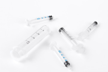 Group of syringes without needles. Plastic medical syringes without needle on white background. Medicine and medical equipment.