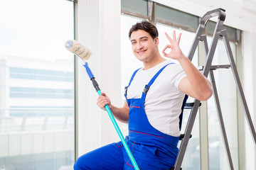 Painter repairman working at construction site