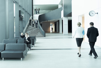 Business people at hall of office building