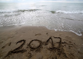 year 2017 on the sand of the sea