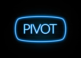 Pivot  - colorful Neon Sign on brickwall