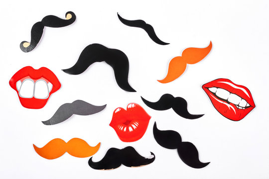 Set of fake moustache and lips. Mustaches and lips masks for carnival, isolated on white background. Wedding or party concept.