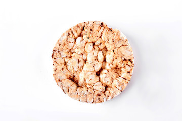Puffed whole grain crispbread. Round wheat and buckwheat crispbread isolated on white background, top view. Dietary and healthy cookie.