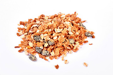 Oat flakes with raisins, white background. Heap of oat flakes on white background. Healthy and nutritious diet concept.