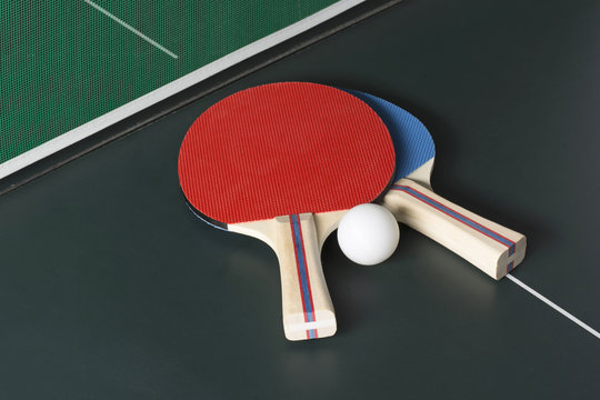 Ping Pong Paddles on Table, both on same side