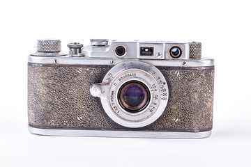 Old grey camera on white background. Vintage photo camera isolated on white background. Soviet camera, front view.