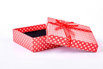 Open red gift box. Opened red present box, white background. Christmas and holidays concept.