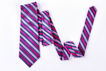 Striped necktie on white background. Pink and grey stripes business necktie isolated on white background.