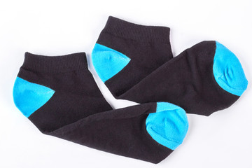 Pair of woolen socks for boy. Black and blue boy socks of high quality, white backgroud.