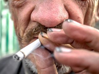 Homeless man with a cigarette