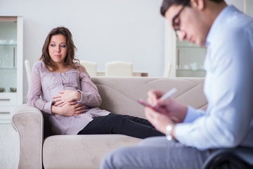 Fototapeta na wymiar Pregnant woman visiting psychologist doctor