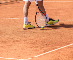 Fototapeta na wymiar Tennis Ball on the ground court