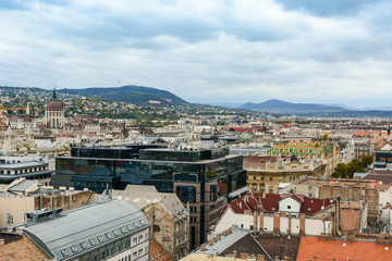 Cityscape of Budapest and Hungarian Parliament. Old european town with dramatic clouds