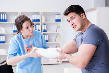 Doctor and patient during check-up for injury in hospital