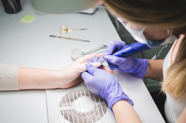 Closeup of manicurist at work