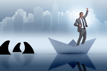 Obraz premium Excited businessman riding paper ship boat