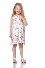 Little girl holding her thumb up