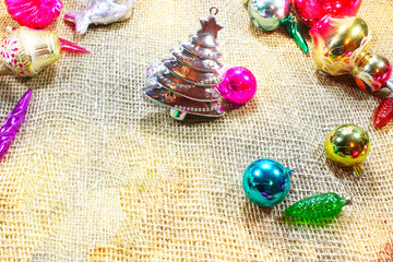 Christmas background. Holiday view from above on Christmas decorations, located on a rough fabric , space for text