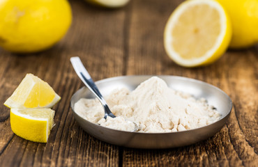 Portion of fresh Lemon powder (selective focus; close-up shot)