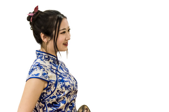 A young oriental girl in Cheongsam (Qi Pao) is preparing for fashion show