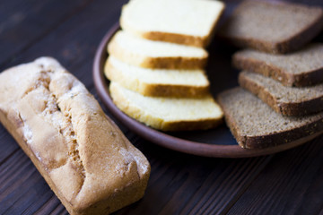 Cupcake and bread on a clay platter on the table. Healthy fresh food.