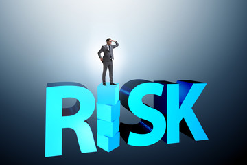 Businessman in risk and reward business concept