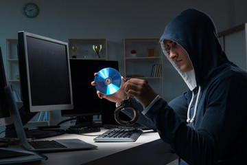 Hacker hacking computer at night