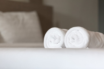 Obraz na płótnie Canvas White towel on the bed in hotel room