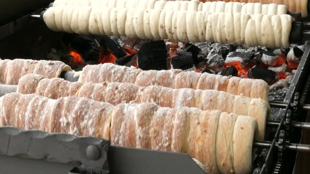 National Czech trdelnik sweet delicacy that prepared on the street.Traditional Czech and Hungarian sweet bakery trdelnik cooked on the street of Prague.