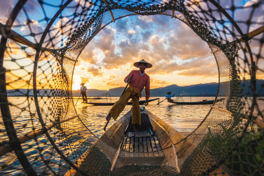 Intha fishermen at sunset, Inle Lake, Myanmar