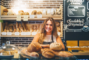 Woman sells in bakery.