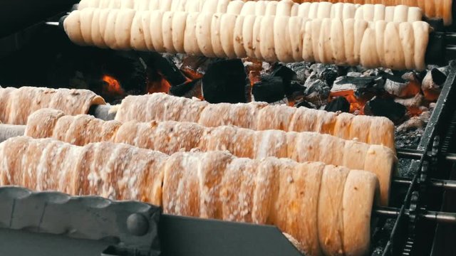 National Czech trdelnik sweet delicacy that prepared on the street.Traditional Czech and Hungarian sweet bakery trdelnik cooked on the street of Prague.