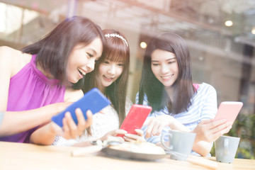 happy woman friends in restaurant