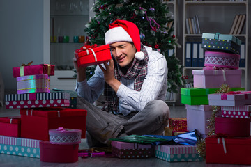 Man with many christmas gifts in boxes