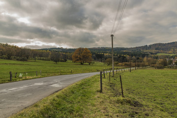 Fototapeta na wymiar Green view near Tasov village in Ceske Stredohori mountains