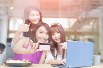happy woman friends in restaurant