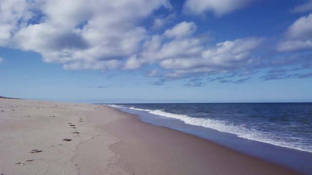 National seashore beach in real time with waves and clouds