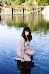 Fototapeta premium Plump Caucasian Teen In River With Bikini