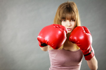 Woman wearing boxing gloves