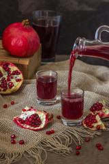 Pomegranate juice and fruit slices rustic style