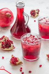 Pomegranat juice with ice and fruit slices