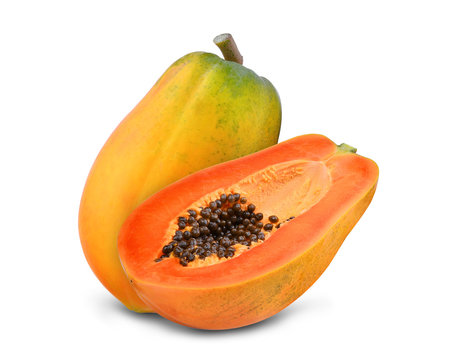 whole and half of ripe papaya isolated on white background