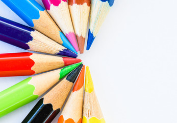Fototapeta premium Closeup different colored pencils on white background.