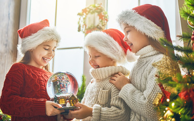 children with snow globe