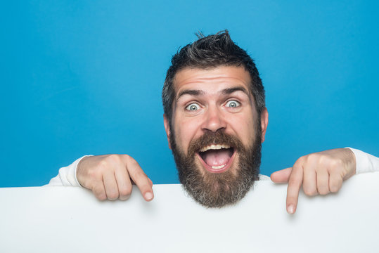 man with long beard on happy face with paper