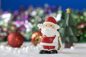 Santa claus Standing with Gift Box on bokeh background. Christman Concept.
