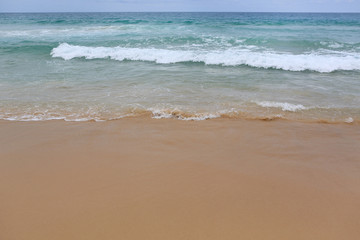 Fototapeta na wymiar Landscape view of sea wave on the beach sand.