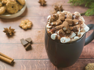 Christmas drink Hot chocolate with marshmallow and cinnamon sticks, cookies. Christmas winter concept. Close up