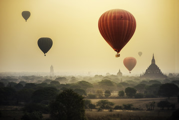 Hot air balloon over plain of Bagan in misty morning, Mandalay, Myanmar